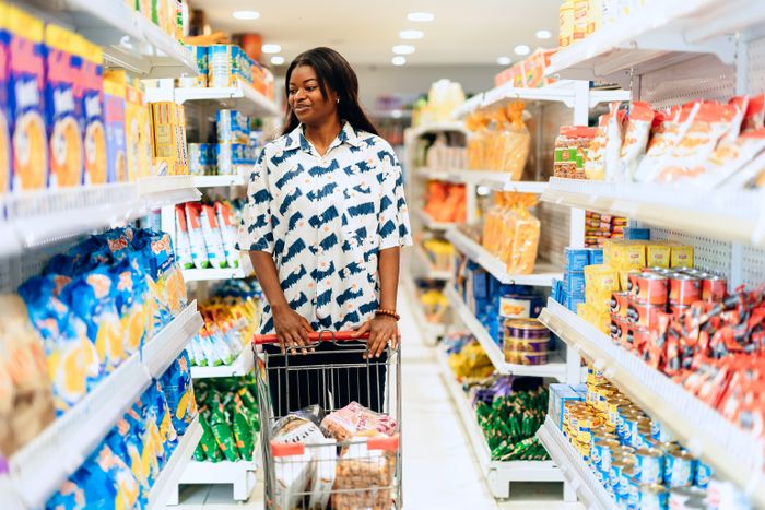 Customer shopping in a supermarket aisle